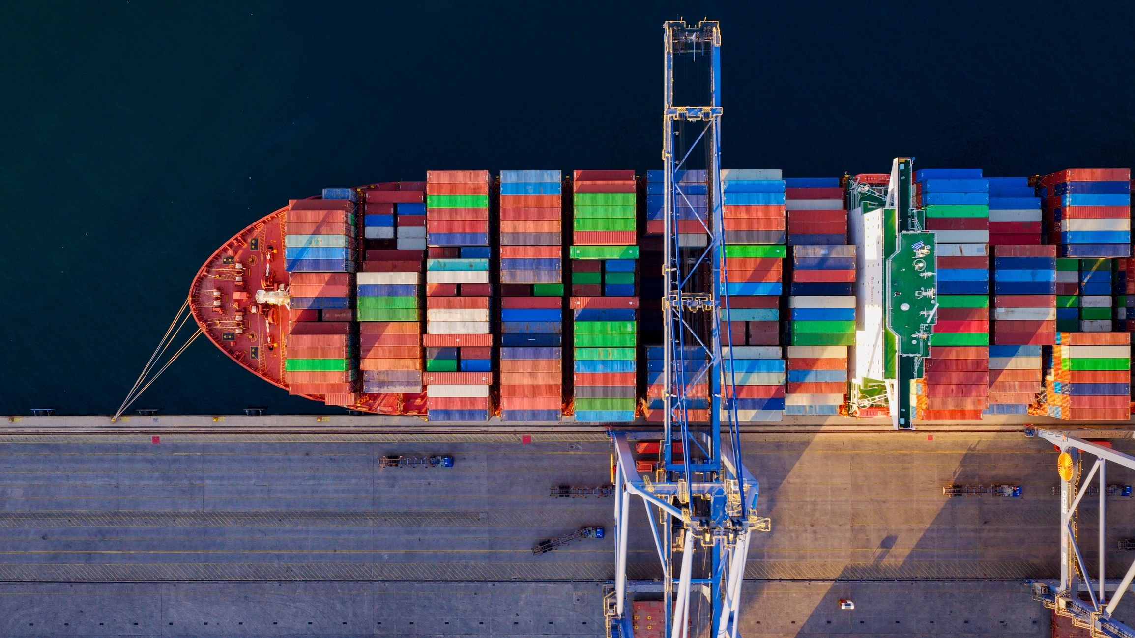 Container ship at commercial port supporting international trade logistics